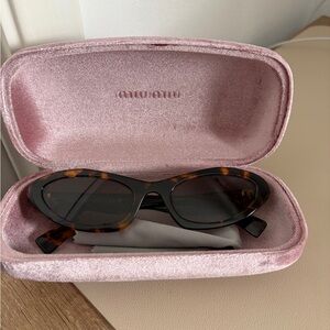 Miu Miu Tortoiseshell Oval Sunglasses with Dark Brown Lenses